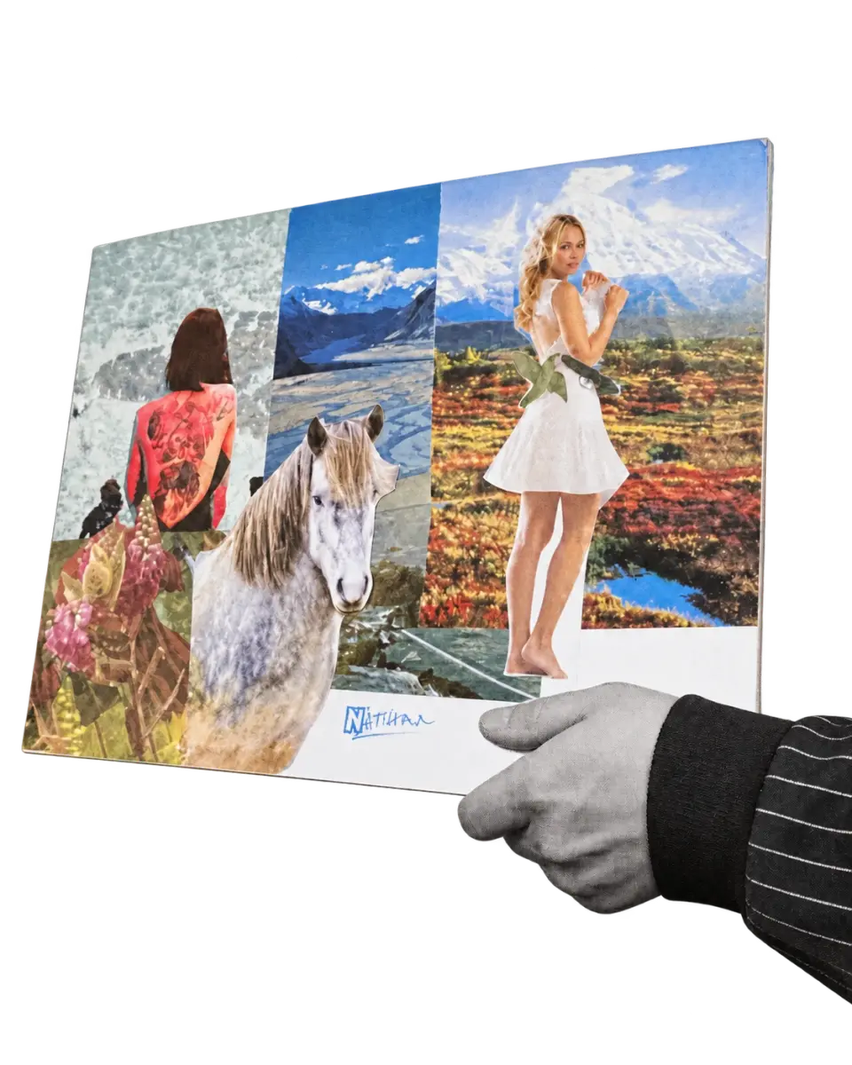A participant holding a colourful finished magazine collage made during the Mental Bytes IPS retreat
